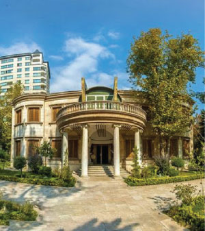 Front of zip tote bag with white canvas, black canvas straps and handle, and black zipper pulls.