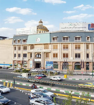 Front of zip tote bag with white canvas, black canvas straps and handle, and black zipper pulls.